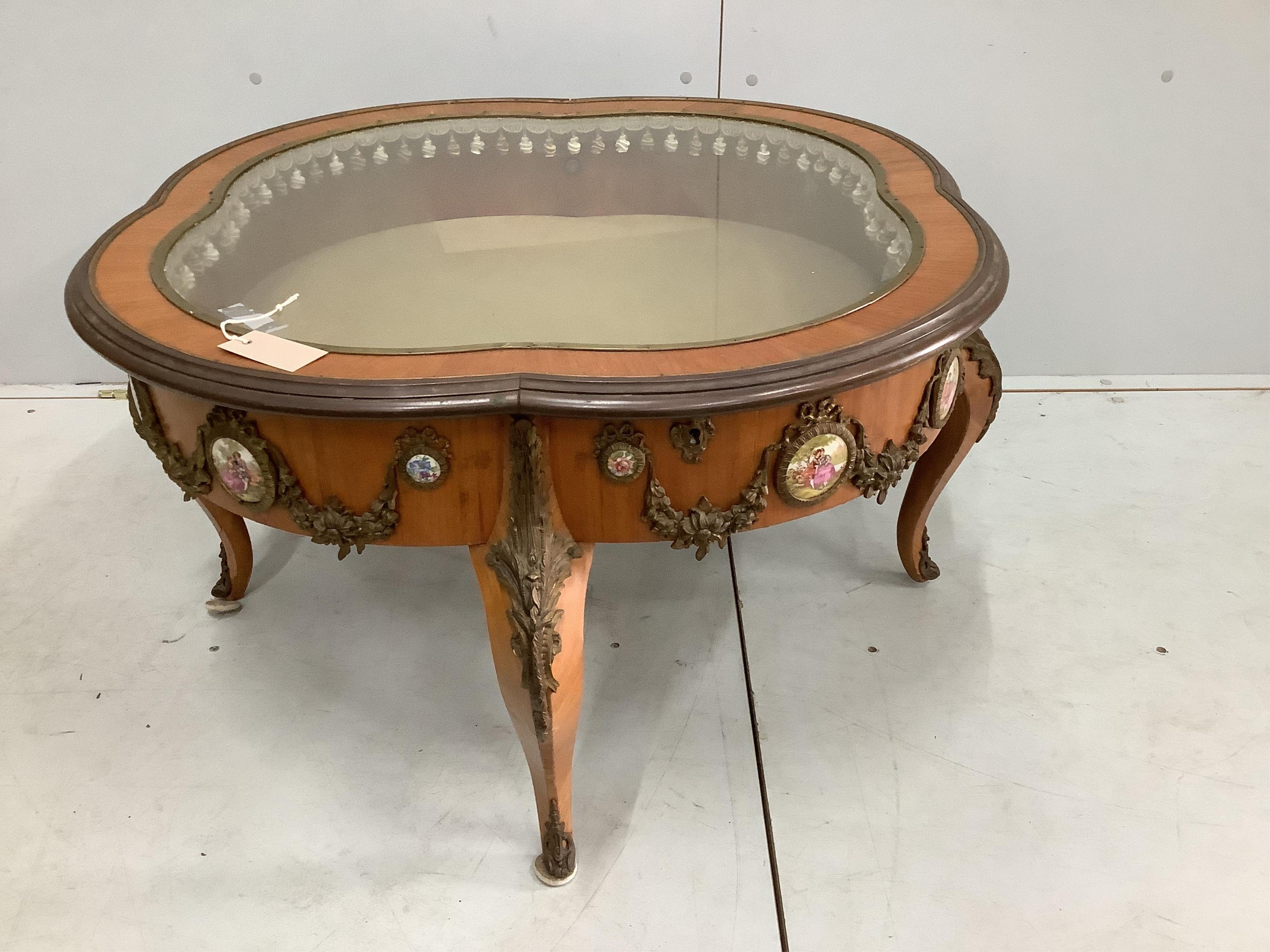 A French gilt metal mounted kingwood bijouterie table, width 95cm, height 48cm